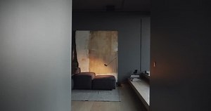 Real Contemporary minimalist interior design, the living room with black, gray tone, with italian black furniture and large paintings , with large sliding windows. Modern Apartment