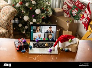 Virtual Christmas tree meeting team teleworking. Family video call remote conference. Laptop webcam screen view. Team meet working from their home Stock Photo - Alamy