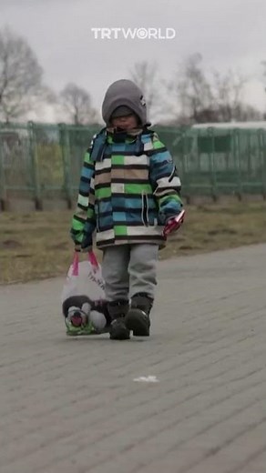 Ukrainian boy cries as he crosses the Poland border
