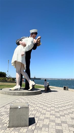 Romance on the Bay: The Famous Kiss Statue by the USS Midway | San Diego