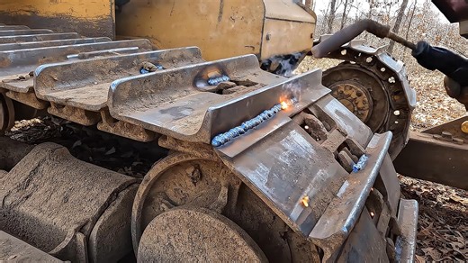 New grouser bars welded on dozer pads – will they hold?