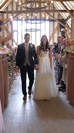 bride and groom walk up the aisle