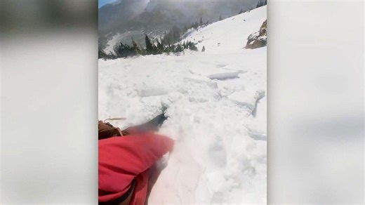 Warning: Watch the terrifying moment a skier is briefly buried in avalanche