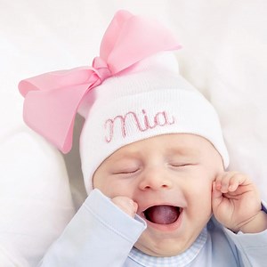 Welcome your little princess to the world with a personalized newborn girl hat. Adorable and customized just for her. | Callie Gifts