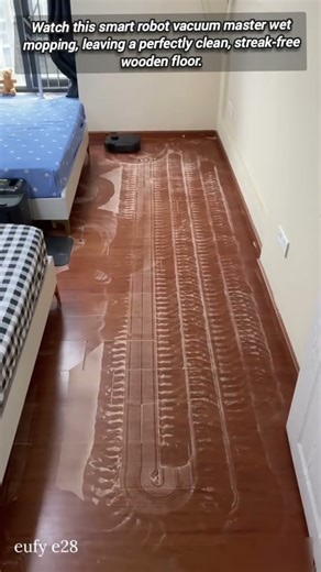 Robot Vacuum Flawlessly Mopping a Wet Wooden Floor.
