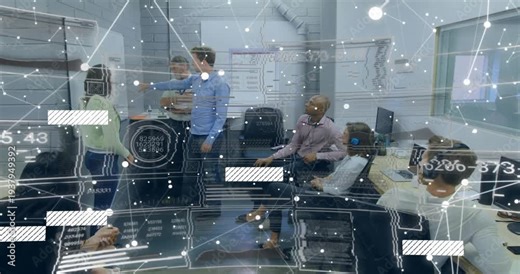 Trainer starting demo by pointing, guiding trainees while AR nodes and links overlaying monitors