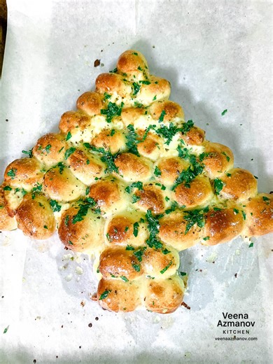 Veena Azmanov Kitchen (Cooking & Baking) on Instagram: "Cheesy Christmas tree pull-apart bread brushed with garlic herb butter 🎄🧀 Made with pizza dough, stuffed with melty cheese, and baked until golden. This one sits in the middle of the table and quietly disappears—everyone just pulls off a piece and goes back for more. Perfect for holiday parties, Christmas Eve, or anytime you want something festive without the fuss. Comment - Christmas Tree - to get the recipe sent to your DM! All you need
