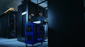 clip-1022551702-time-lapse-data-center-specialists-engineers-working