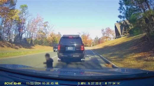 Caught on camera: Toddler running alongside busy road, man jumps out of car to get child to safety