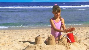 Little Girl Playing On Beach Stock Footage Video (100% Royalty-free) 5655458 | Shutterstock