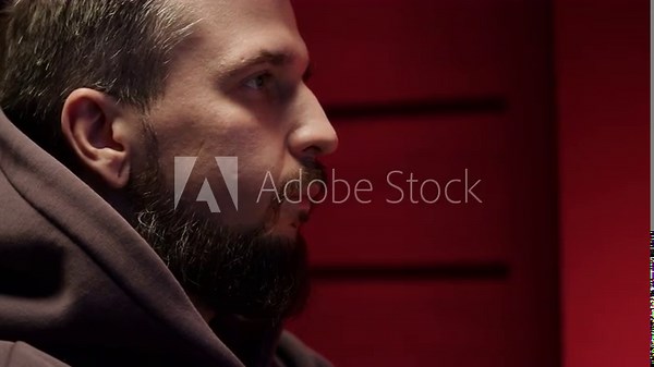 Portrait of young man looking at computer close-up .Gamer playing video games online. Typing and clicking pc mouse. Streaming platform, cyberspace. Male programer coding on his personal computer.