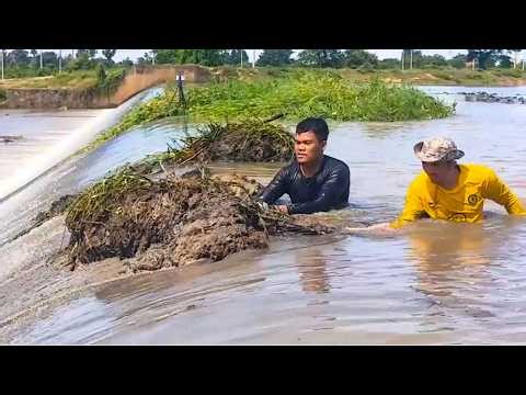 Action Remove Grass And Mud Growth Over Dam Drainage After Heavy Rain