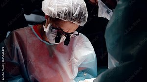 Modern hospital operating room dedicated surgical team carries out complex operation healthcare. Meticulous work of surgical team crucial operation advanced medicine teamwork in patient care.