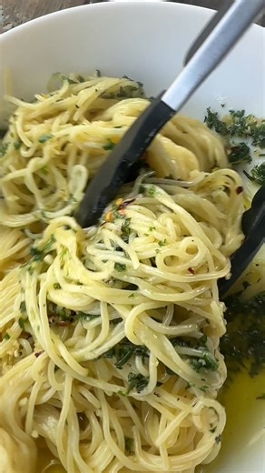 7.4K views · 42 reactions | This simple and delicious Italian dish is perfect for a quick weeknight meal. Learn how to make spaghetti aglio e olio with just a few ingredients and enjoy a flavorful sizzle in every bite✨ Recipe: https://ohsweetbasil.com/easy-sizzling-italian-spaghetti-aglio-e-olio-video/ #ohsweetbasil #recipe #dinner #meals #asmr #sizzling #pasta #spaghettiaglioeolio | Sweet Basil | Facebook