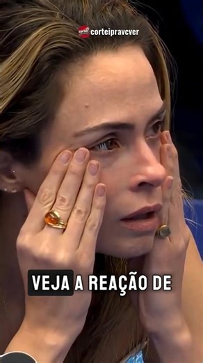 Ana Paula's reaction upon learning of her father's loss.