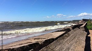 Concrete blocks on the sandy beach. Gulf of Finland, Kurortny district, Leningrad region