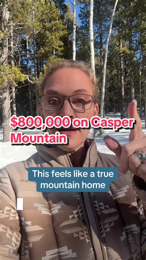 Here’s what $800,000 buys you on Casper Mountain. 🏔 Two acres 🏡 True mountain-home feel 🛠 Additional shop near the road ❄ About 12 degrees colder than town 🌲 12–15 miles up the mountain And you can feel it. Vaulted ceilings. A wall of windows. Rock fireplace all the way up. Propane gas fireplace for those snowy nights. The primary suite is on the main level with vaulted ceilings, a barn door, and a bathroom that feels like a spa. That trough-style sink? Obsessed. And that soaker tub with the