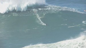 Surfers ride huge waves in Nazare