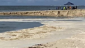 Watch: Amazing footage as sinkhole opens up on popular Qld beach