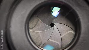 Diaphragm blades of the fixed lens opening and closing aperture f-stop adjustment of a photo camera close-up shot