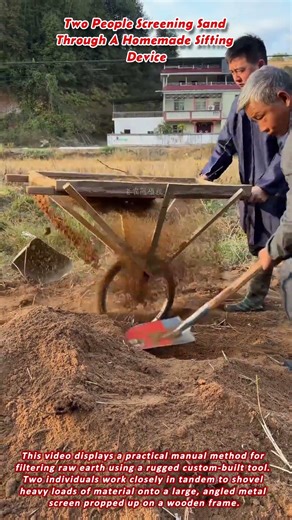 Two People Screening Sand Through A Homemade Sifting Device