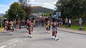 Leading Drum Major Roland Stuart leading the massed pipe bands through the village of Braemar in Royal Deeside, Aberdeenshire, Scotland, to the 2023 Braemar Gathering. This was on Saturday 2nd September 2023 and the massed bands were playing on the march through the village for their noon display around the Games field. The bands taking part were Ballater & District Pipe Band, Huntly & District Pipe Band, Lonach Pipe Band, Kintore Pipe Band, Ellon & District RBL Pipe Band, Fraserburgh R.B.L Pipe