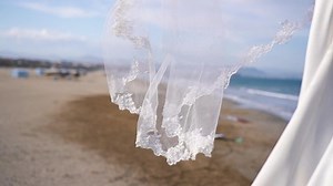 clip-1048133341-bridal-veil-blowing-on-wind-beach-near