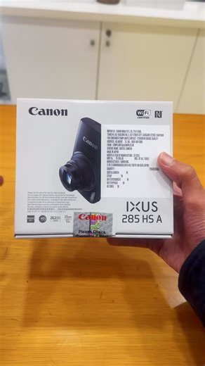 Canon Image Square/ Apollo Photographics on Instagram: "Still sealed. Still legendary. 📦📸 The Canon IXUS 285 HS A , proof that great design never goes out of style. Unbox it… or keep the mystery alive? LIMITED STOCK #CanonIXUS #Canon285HS #CameraReels #PhotographyGear PointAndShoot TechAesthetic UnboxingSoon"
