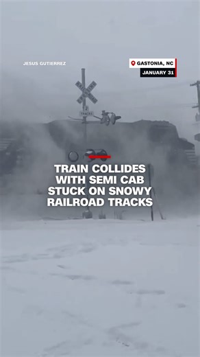 Video shows a train colliding with a semi cab stuck on snow-covered railroad tracks. The driver escaped safely before the incident and no one was injured or killed in the incident, according to the Gastonia Police Department. | CNN