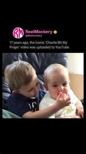 Reel Mockery on Instagram: "“One of the most iconic videos ever” 😭☝️ Back in 2007, two little British brothers—Harry and Charlie Davies-Carr—changed internet history forever with 56 seconds of pure chaos. Harry’s chilling with his finger in baby Charlie’s mouth, thinking it’s all cute… until Charlie chomps down and Harry lets out that legendary “Ouch, Charlie! That really hurt!” followed by “Charlie bit me!” 😭. The accent, the delayed reaction, Charlie’s little smirk after the bite, Harry’s mi