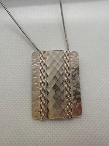Textured silver pendant