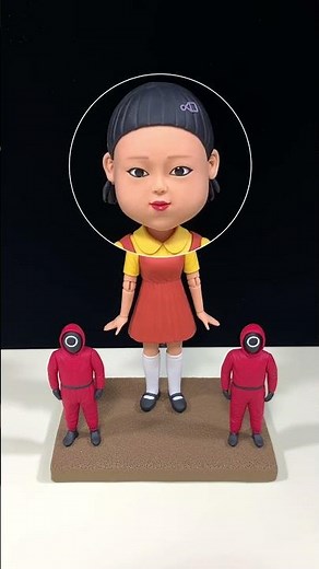Clay Bobbleheads Step into the One-Two-Three Wooden Man Game with the Doll