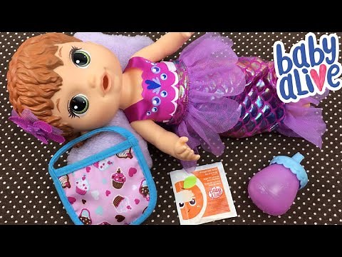 Feeding Baby Alive Shimmer n Splash Mermaid a Bottle of Orange Doll Juice