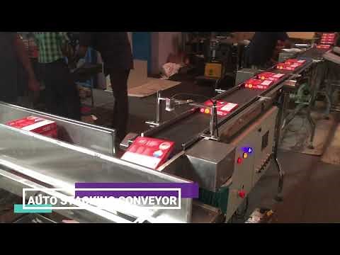 Automatic stacking conveyor system - MGEE Industries