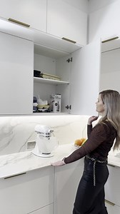 The kitchen design shows how design elements can be pushed with a perfect blend of elegance and functionality. Using sleek countertops and seamless cabinetry, with subtle curves of the island gives a luxurious feel. #EasylifeKitchens #HomeDesign #KitchenDesign #Renovations | Easylife Kitchens