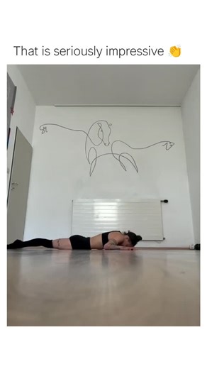 memefount on Instagram: "The Instagram reel of a tattooed woman executing fluid, extreme contortions on the floor in a minimalist room, transitioning from supine positions to arched handstands that defy typical human flexibility limits, earning 14k+ likes for its mesmerizing display. User replies highlight anatomical flaws, such as elbows bending unnaturally backward, fueling speculation that it's AI-generated rather than a genuine gymnast or contortionist routine, a common critique in viral dee