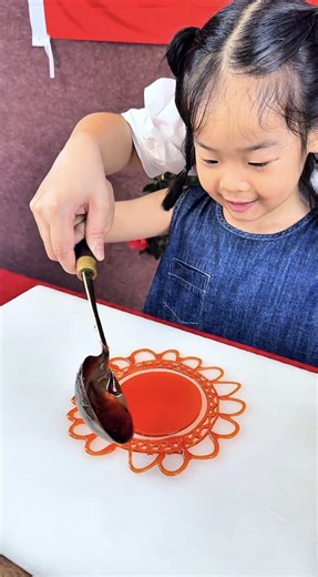 Sugar painting is a traditional Chinese art where melted sugar is shaped into intricate, edible forms such as dragons and butterflies. In Nantong, it is recognized as an intangible cultural heritage, with artisans creating each piece to please both the eye and the palate. Artist: 584980736 / 糖画queen on Douyin #art #sugar #painting