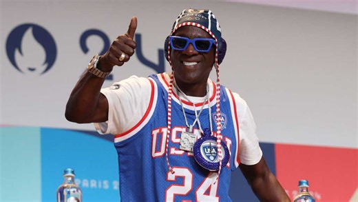 Flavor Flav makes bronze clock necklace for Jordan Chiles