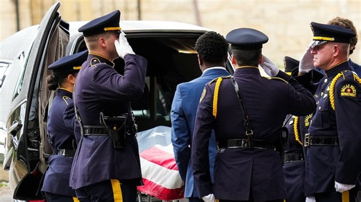 Dallas officer escorted by police processional to funeral home