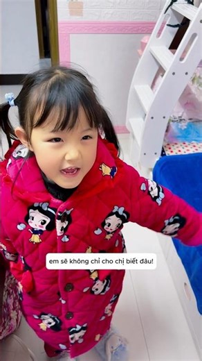 The little girl had a cute game that surprised her older sister.