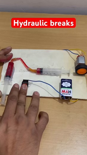 School project wala Hydraulic Brakes model ready! 🔥 Bas syringe pipe water = pressure se brake apply 😍 Simple aur super informative DIY! #hydraulicbrakes #schoolproject #scienceproject #voltvigyan #diyprojects #engineeringlife #techhacks #scienceexperiment | Volt Vigyan