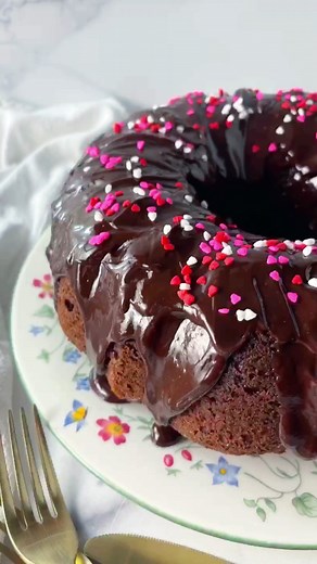 This is a doctored up cake mix and the most delicious Double Chocolate Chip Bundt Cake that's ready for the oven in about 10 minutes! My neighbor gave me this recipe card years ago and it was called Pam's Chocolate Cake. I recently made it for my friend at church named Pam (by coincidence). Seemed appropriate. And also, it's really delicious but you can whip it up in minutes (plus the baking time)! p.s. Pam loved it! And that made me happy because she's a very sweet friend and it was her birthda