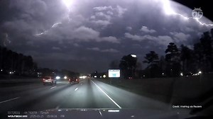 ⚡️Close call in Atlanta! Lightning struck right next to a car on the road—an intense reminder of how powerful storms can be. 🚗 Did you know? A car is actually one of the safest places to be during lightning, but not because of the rubber tires—it’s the metal frame that channels the electricity around you. | WeatherBug