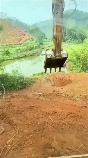 Excavator track detaches, plunging into the river below