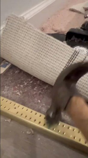 Installing carpet transition strips and nailing it down