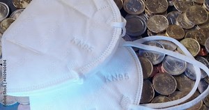 Face Mask KN95 on Euro Coins. Europe Economy crisis after Health crisis and disaster. White Face Mask on Money Currency from European Union