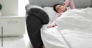 Woman wake up in the morning after sleep in a pink pajama