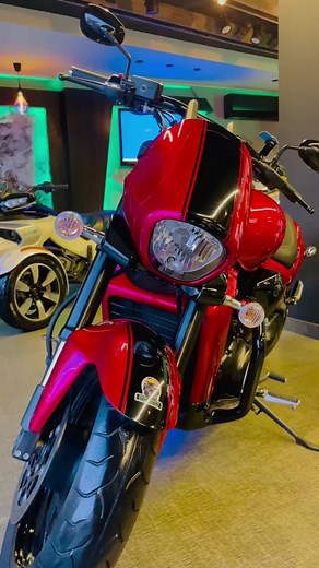 Sleek Red Motorcycle Showcase in Modern Showroom