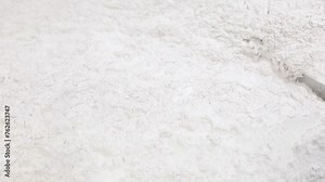 powder medicine mixing and blending process close up. dusting powder chemical pharma ingredient in a large equipment production line in a pharma manufacturing plant factory