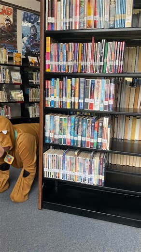 Scooby sniffed out the best finds in the library — a stack of Scooby Snacks and a pawsome book! 🐾📖 #IukaLibrary #LibraryFun #HalloweenAtTheLibrary #CostumeWeek #LibraryLife #MysteryIncorporated #ScoobyDooCostume | Iuka Public Library